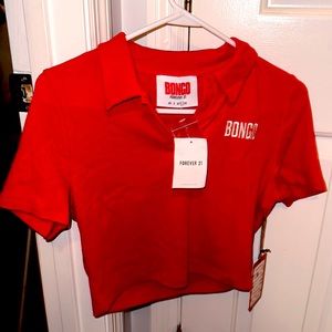 A Forever 21 top never worn. It still has the tag and it has an extra button.